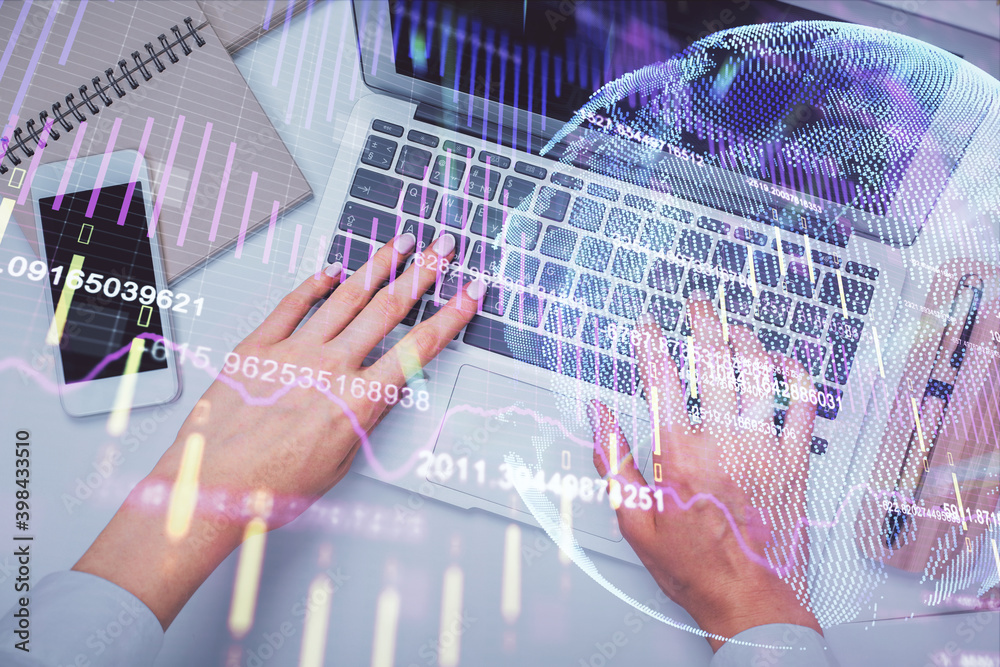 Double exposure of woman hands working on computer and forex graph hologram drawing. Top View. Financial analysis concept.