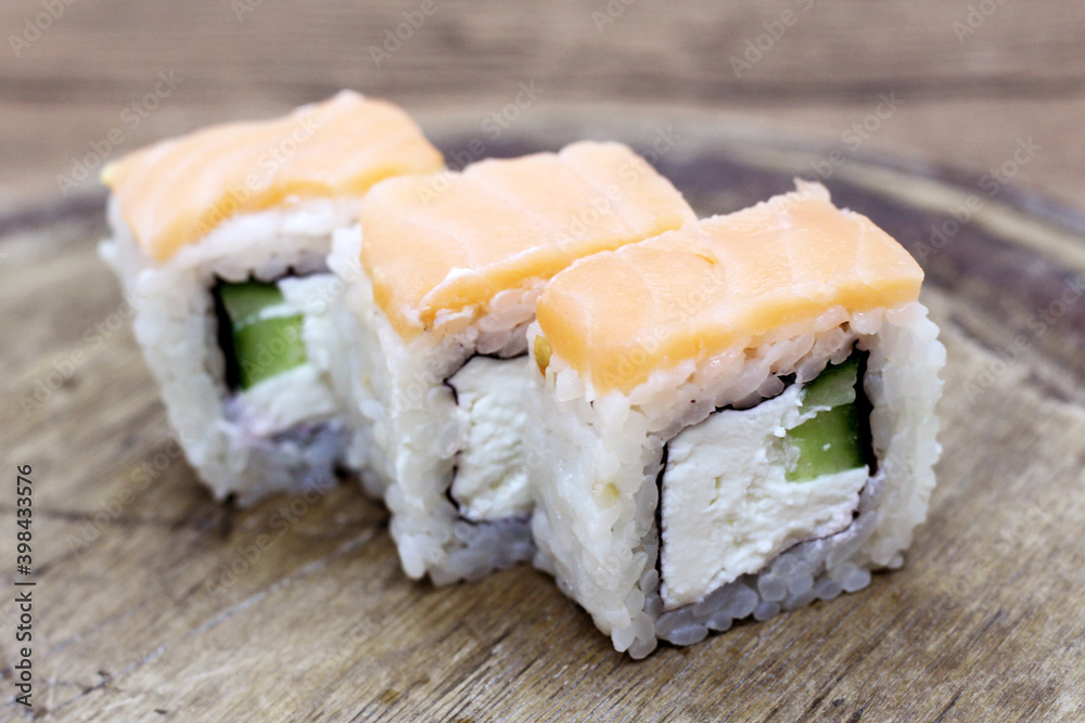 Sushi philadelphia in tempura on a wooden table Sushi philadelphia in tempura on a wooden table