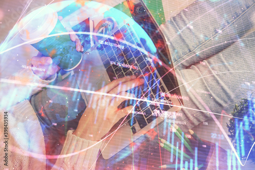 Double exposure of woman hands typing on computer and forex chart hologram drawing. Stock market invest concept.