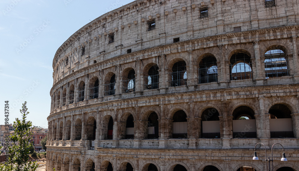 Roman colosseum close up. An ancient arched structure on a sunny day.