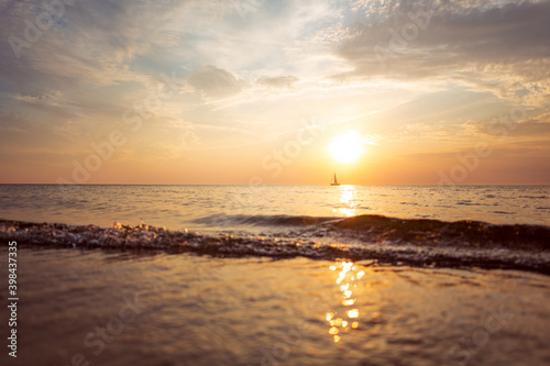 A boat on the horizon during sunset at the Baltic Sea 