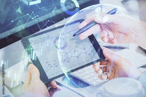 Double exposure of man's hands holding and using a phone and financial chart drawing. Market analysis concept.