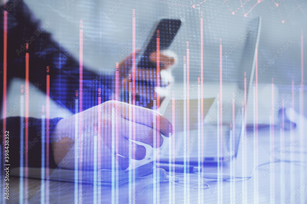 Double exposure of man's hands holding and using a phone and financial graph drawing. Analysis concept. Double exposure of man's hands holding and using a phone and financial graph drawing. Analysis concept.