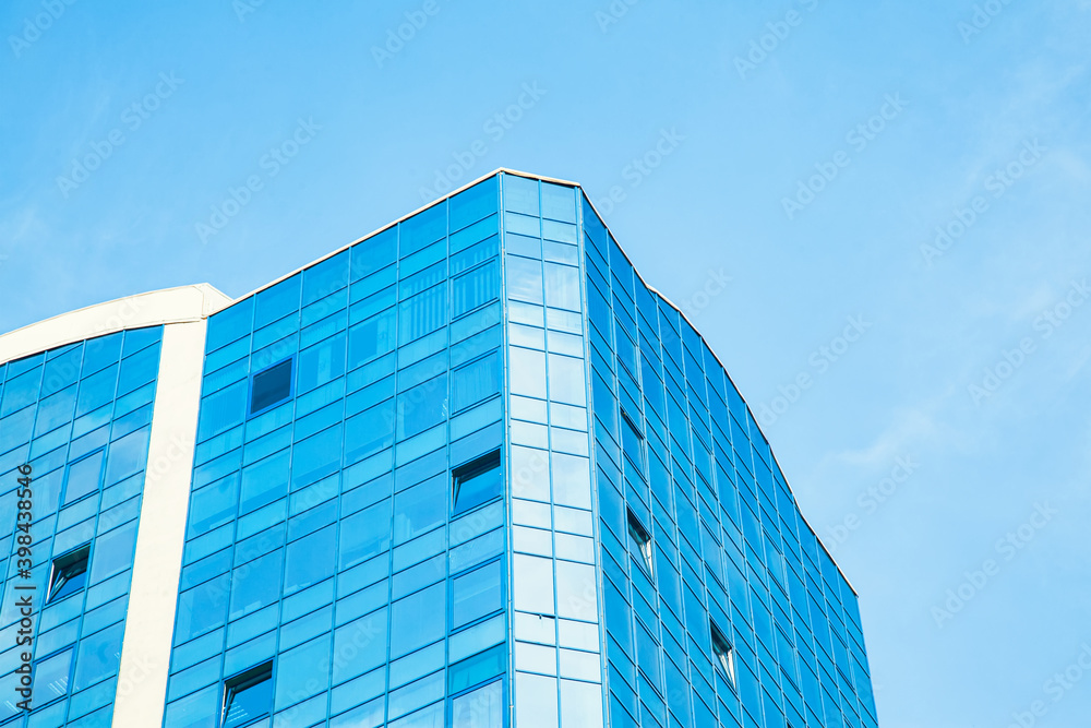 Part of the building with glazed windows against the sky Part of the building with glazed windows against the sky