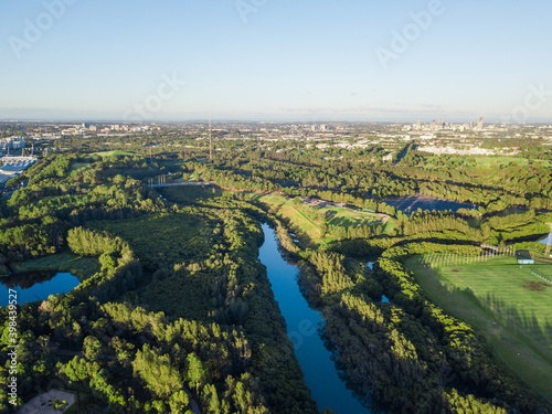 Aerial view of scenic green with small river in the middle. © AlexandraDaryl