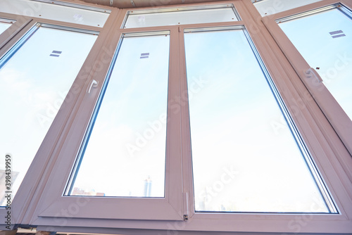 Installation of new plastic windows in housing renovation.