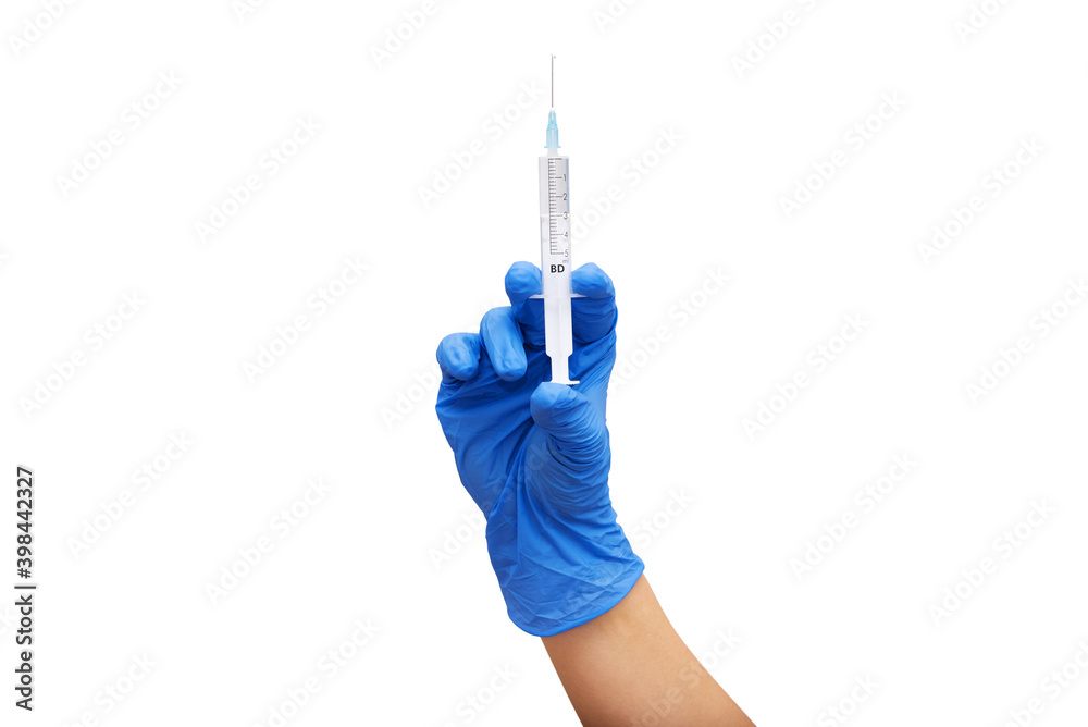Female hand in protective medical blue glove holding syringe on white background. Covid-19 and flu virus vaccination concept. Start of getting vaccine. Closeup.