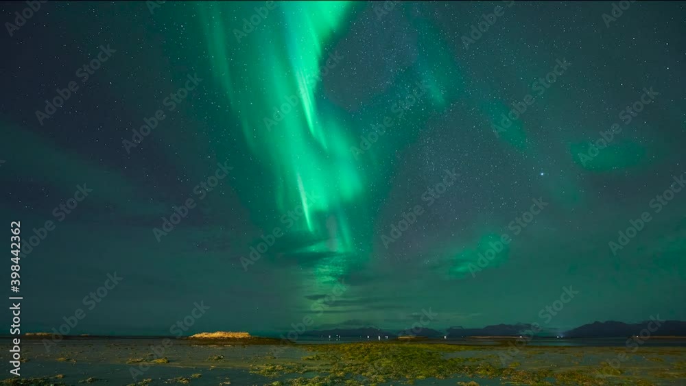 Northern lights over basalt beach