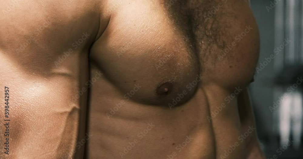 Young athletic muscular man training in the gym
Young athletic muscular man training in the gym