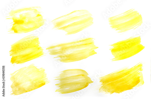 Bright yellow brush stroke painted in watercolor on clean white background