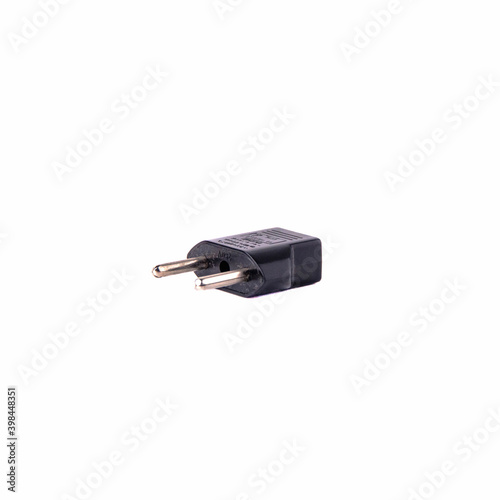 2-pin EU to US plug type Converter black Plastic element isolated on a white background. Close up