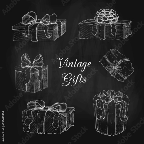 chalk drawn vintage gift box set. engraved illustration of presents isolated on black chalkboard. icon set of present boxes with bow and ribbon. wrapped gifts sketch. Silhouette of boxes on blackboard