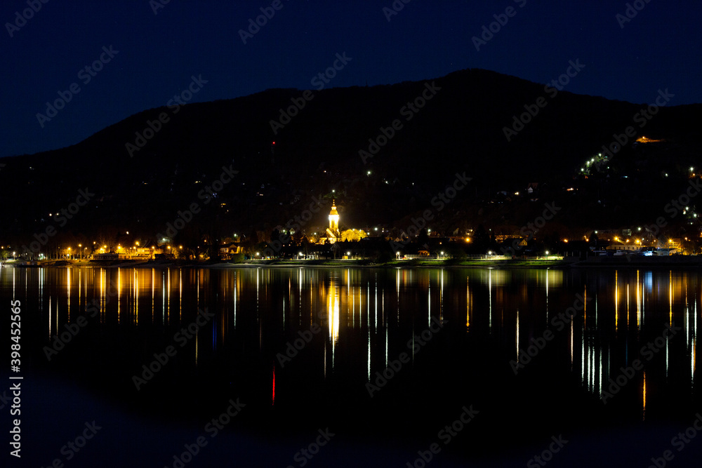 A hungarian village in the night at the Danube