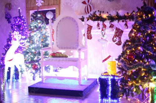 Christmas tree and chair for Santa Claus in a cozy living room