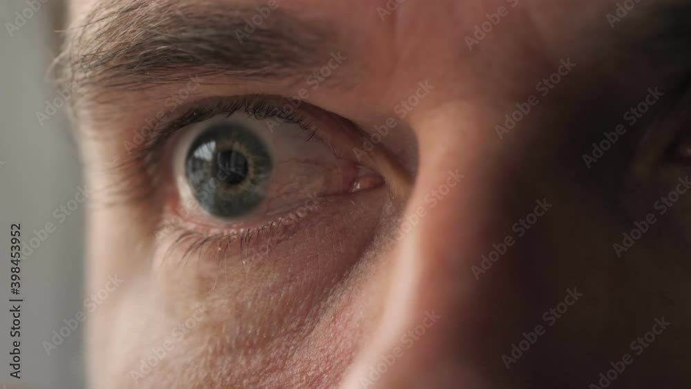 Surprised man with binoculars. Curious guy with big eyes. Silly funny