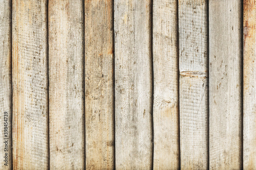 Grunge wood texture. Raw brown wooden wall background. Rustic tree desk with knots pattern. Countryside architecture wall. Village building construction. Wood industry texture.