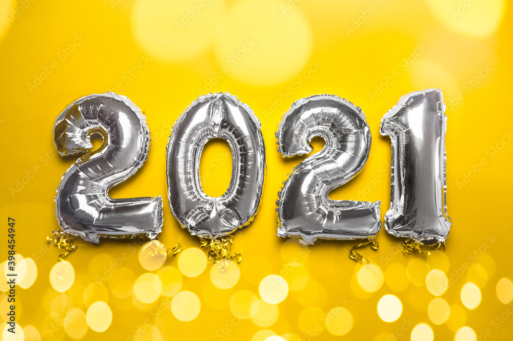Balloon Bunting for celebration of New Year 2021 made from Silver Number Balloons. Holiday Party Decoration or postcard concept, trendy colors of 2021 of yellow and gray Balloon Bunting for celebration of New Year 2021 made from Silver Number Balloons. Holiday Party Decoration or postcard concept, trendy colors of 2021 of yellow and gray