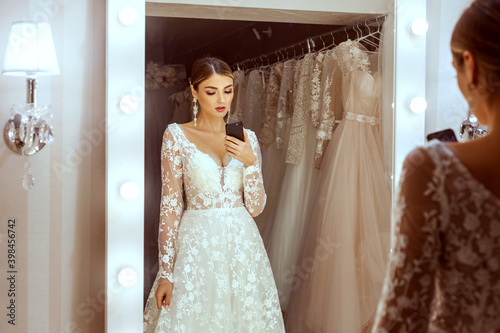 Portrait of a young bride in a wedding boutique.