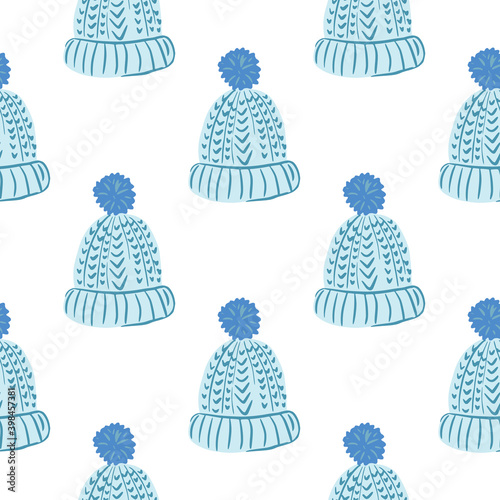 Isolated seamless pattern with blue doodle cozy hat ornament. White background.