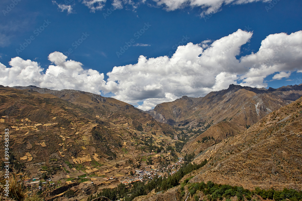 Naklejka premium Big mountain landscape in Peru with a village and trees