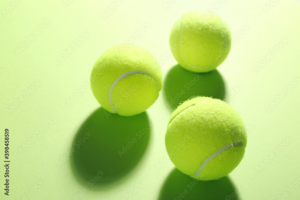 Tennis balls on green background. Sports equipment