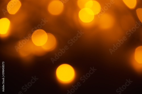 Abstract pattern of golden bokeh lights on dark background © Annuitti