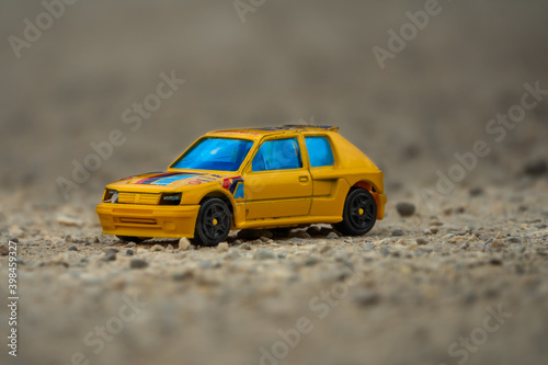 Old rally car on a rocky road.