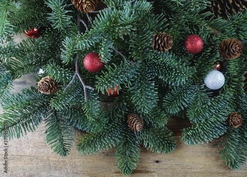 Christmas tree with decoration on the old wooden surface