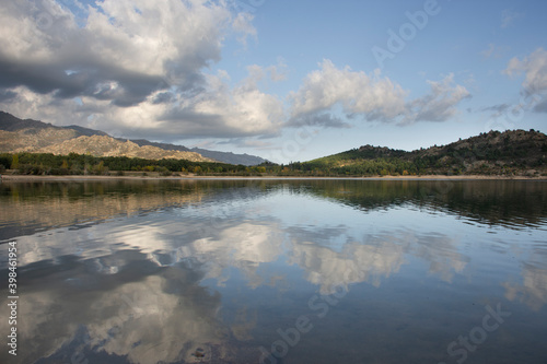 Reflection of mountains and clouds in a lake