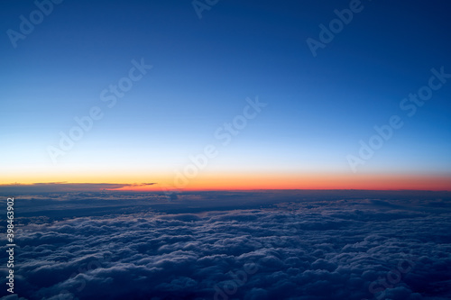 Evening sky with a low layer of clouds, just after sunset seen from an airplane
