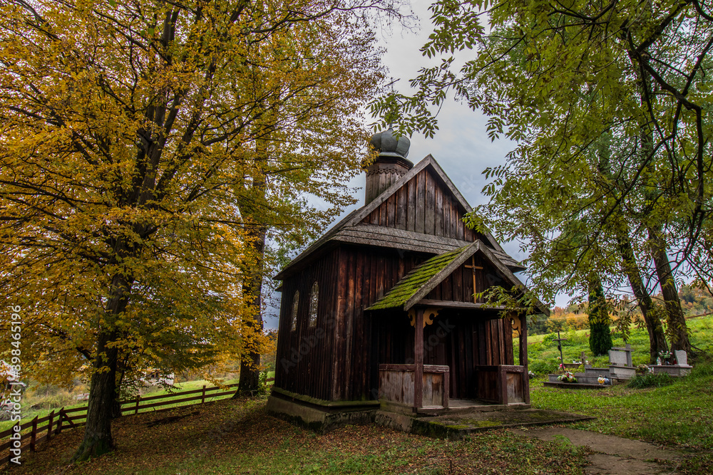 old wooden church in autumn. Koniusza