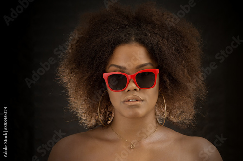 Cool African American woman in red sunglasses