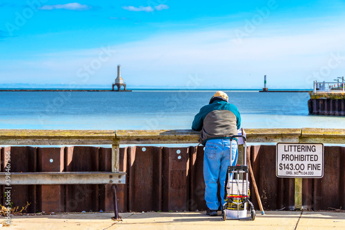 Man is fishing in Port Washington Town of Wisconsin . photo