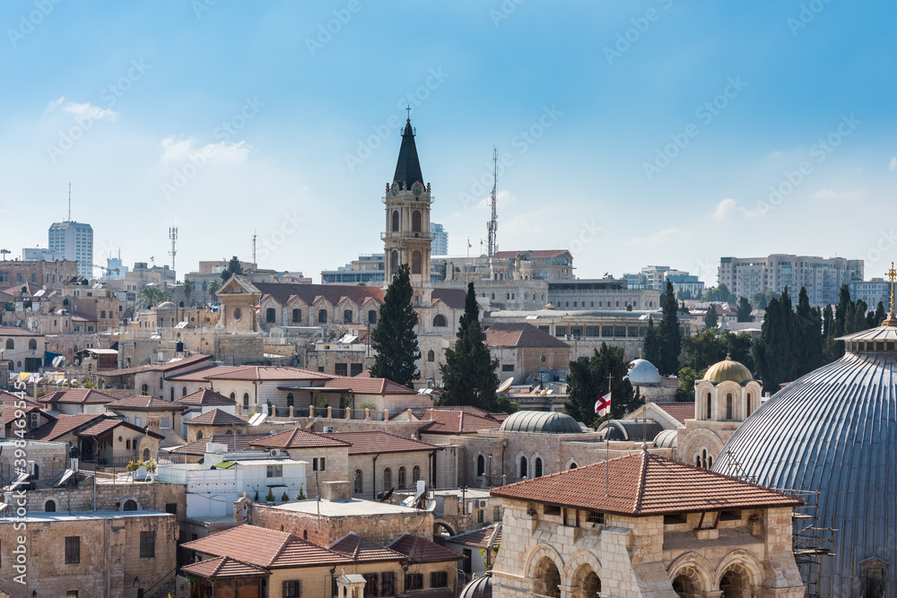 Aerial view of the old city with blue sky of Jerusalem. Christian quarter and dome of  the Church of the Holy Sepulchre and Monastery of Saint Saviour. View from the Lutheran Church of the Redeemer.