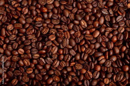 Freshly roasted coffee beans background, close-up