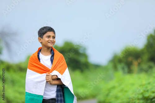 Cute little boy with Indian National Tricolor Flag © PRASANNAPIX