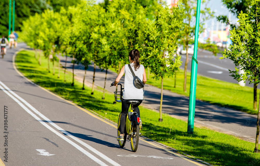 Cyclist ride on the bike path in the city Park
