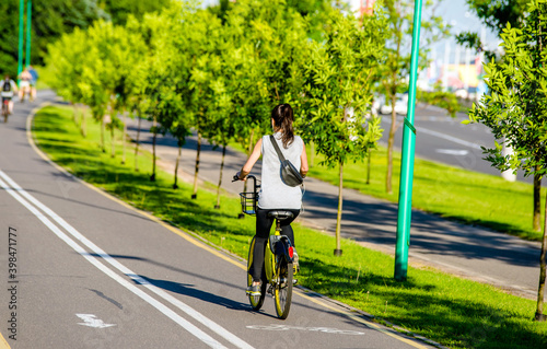 Cyclist ride on the bike path in the city Park  © licvin