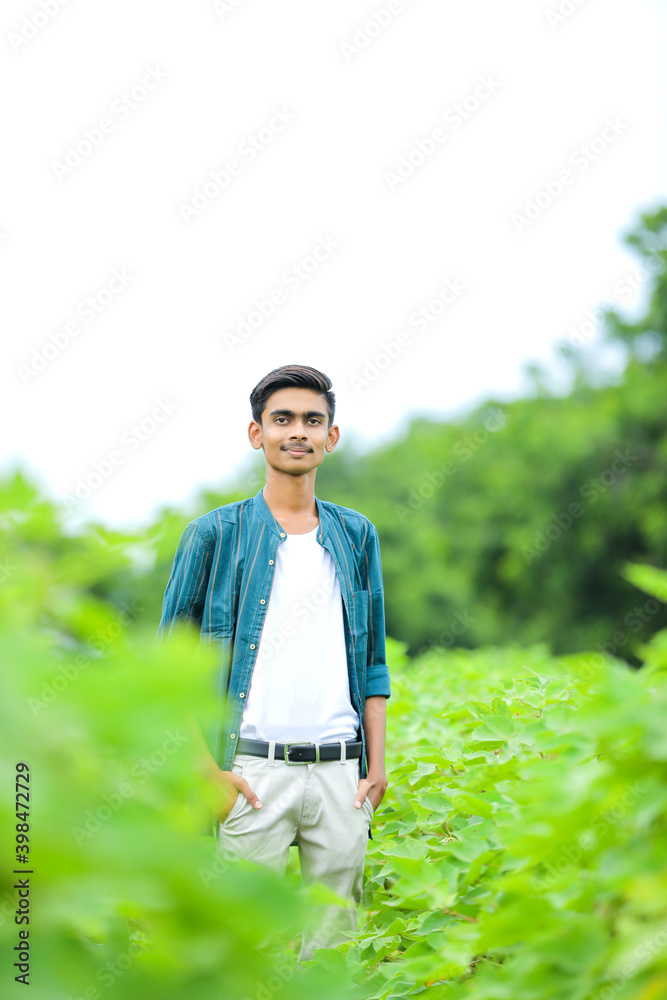 Young indian man showing expression over nature background Young indian man showing expression over nature background
