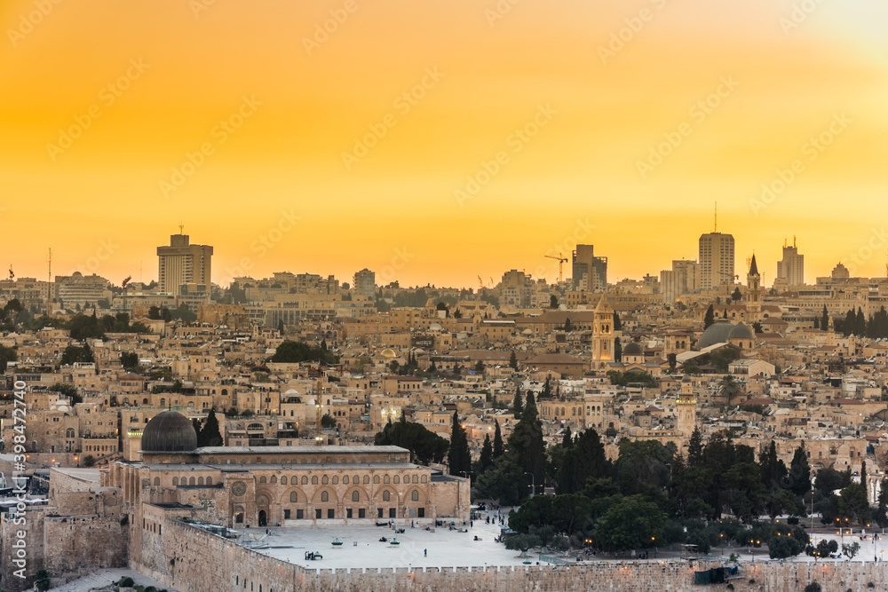 Old city of Jerusalem on the temple mount under golden sunset in the evening with golden dome of the rock, Al-aqsa mosque, view from the Mount of Olives, Jerusalem, Israel