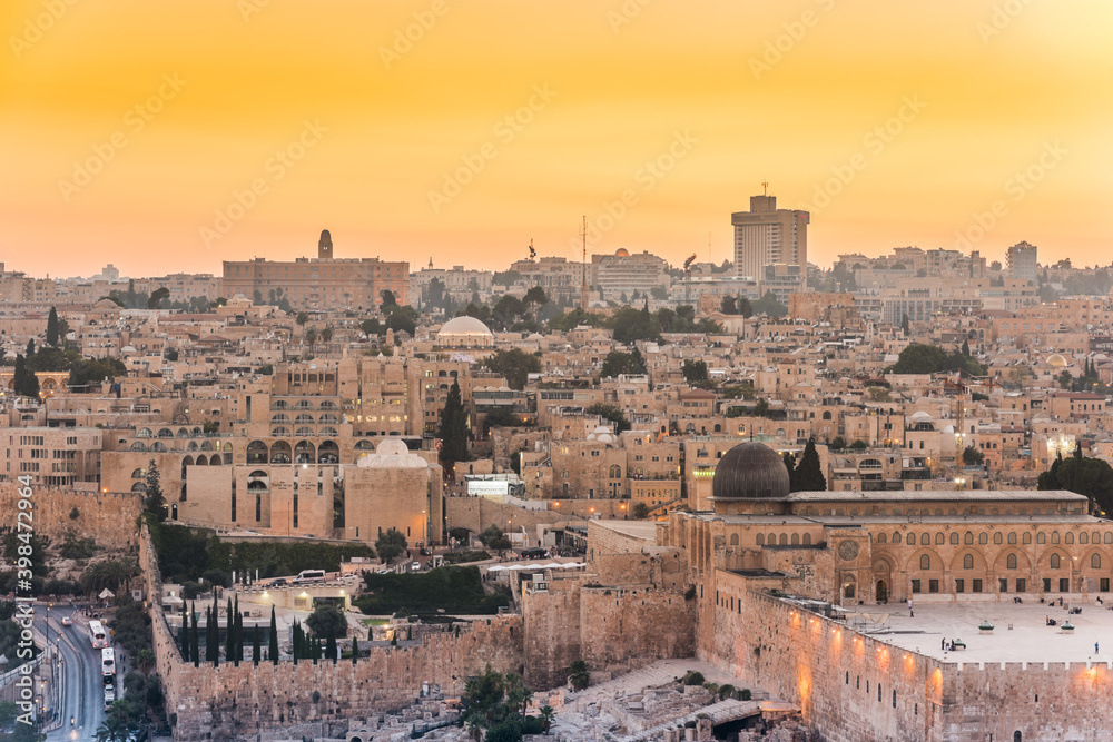Old city of Jerusalem on the temple mount under golden sunset in the evening with golden dome of the rock, Al-aqsa mosque, view from the Mount of Olives, Jerusalem, Israel
