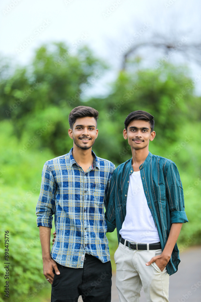 Young indian man showing expression over nature background Young indian man showing expression over nature background