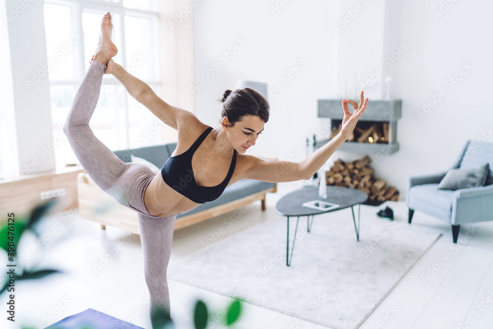 Tranquil Caucasian female in activewear relaxing in Natarajasana keeping healthy lifestyle and wellness, flexible woman enjoying sport and yoga training perfect body shape for mindfulness vitality Tranquil Caucasian female in activewear relaxing in Natarajasana keeping healthy lifestyle and wellness, flexible woman enjoying sport and yoga training perfect body shape for mindfulness vitality