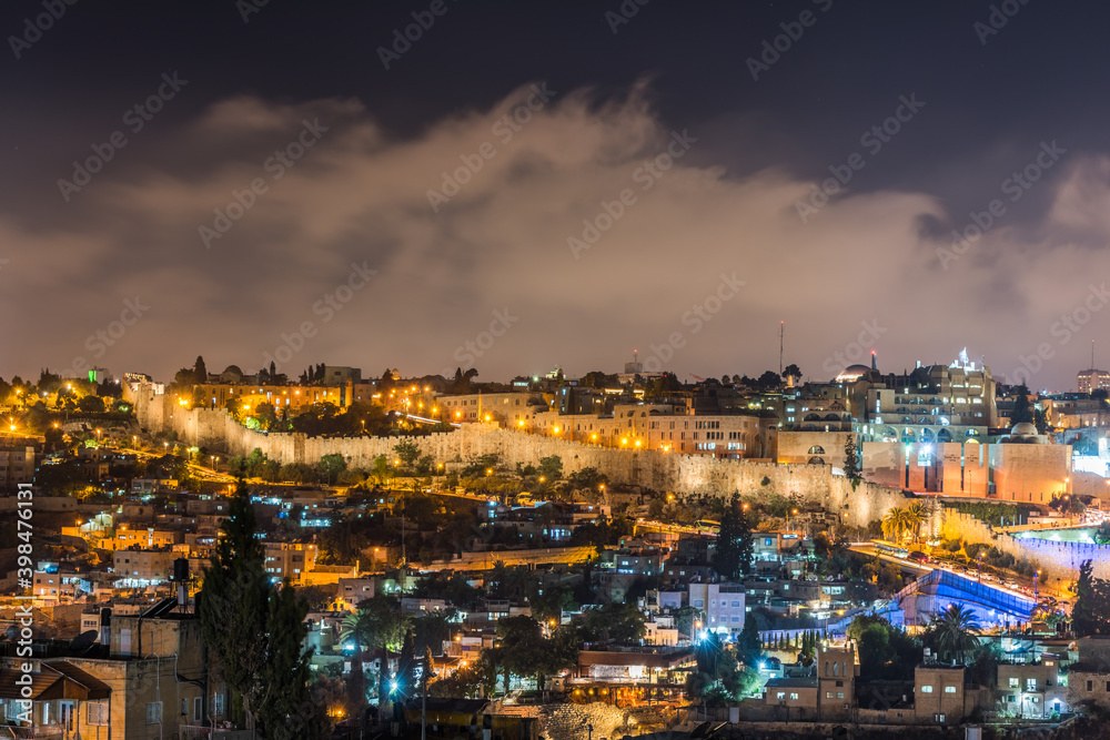 Night view of cityscape and wall of old city Jerusalem built on top of the Temple Mount, View from Mount of Olives.Jerusalem, Israel