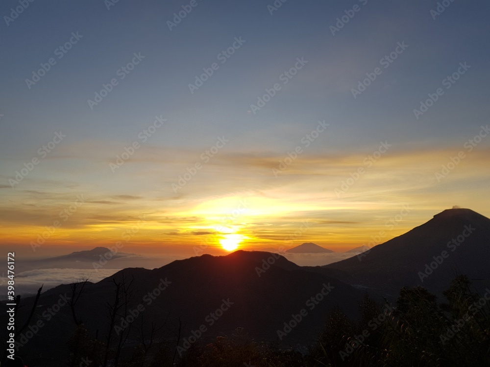 The sun rises on the top of Sikunir hill, Dieng, Java, Indonesia