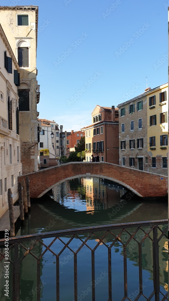 A small bridge and a facade of a building in Venice