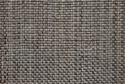 Gray knitting wool fabric fibers texture for background, wool, tweed, melange cloth, closeup fiber weave. Handmade weave fabric wool theater curtain 