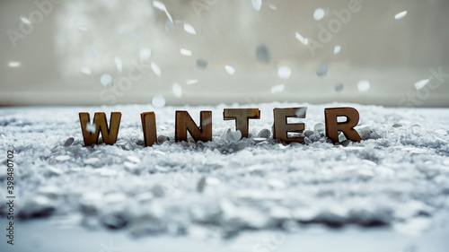 Quadro em tela Winter wooden typography at snow