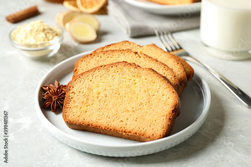 Slices of delicious gingerbread cake served on light grey table