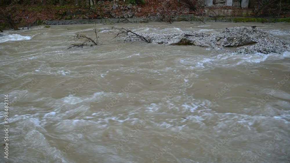 Raging Alpine river Kokra flowing under old concrete bridge in glacial canyon. Natural gorge in Kranj, Slovenia. Tilt up, real time, wide angle Raging Alpine river Kokra flowing under old concrete bridge in glacial canyon. Natural gorge in Kranj, Slovenia. Tilt up, real time, wide angle